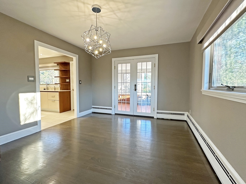 6 Brownson Terrace Boston, MA 02130 - Photo 12 of 38 a view of an empty room with wooden floor and a window