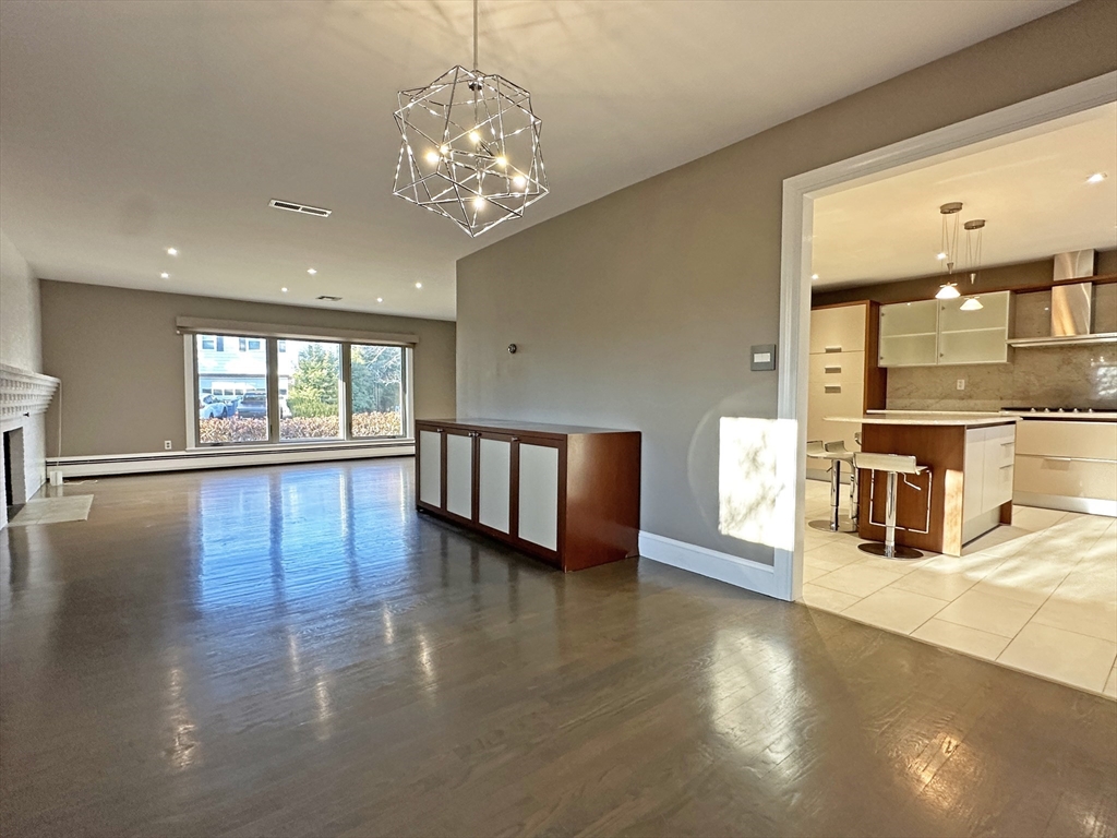 6 Brownson Terrace Boston, MA 02130 - Photo 13 of 38 a view of an empty room with wooden floor and a window