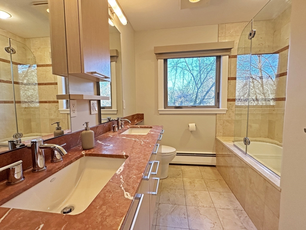 6 Brownson Terrace Boston, MA 02130 - Photo 18 of 38 a bathroom with a tub a sink and a large window