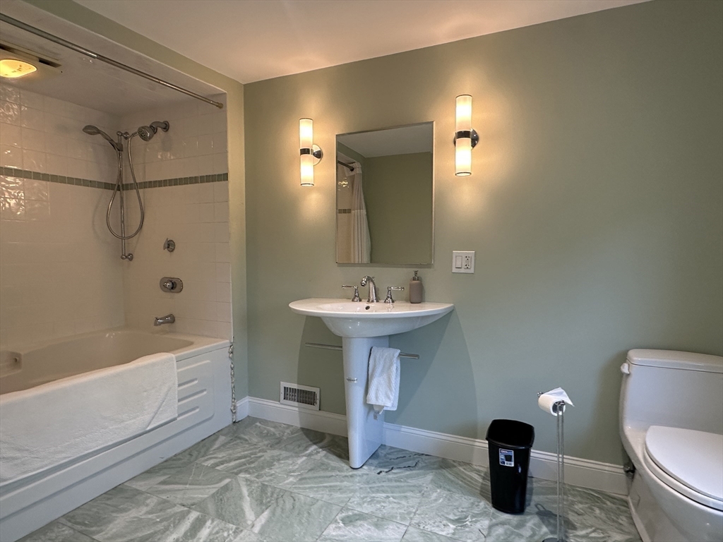 6 Brownson Terrace Boston, MA 02130 - Photo 26 of 38 a bathroom with a sink toilet and shower