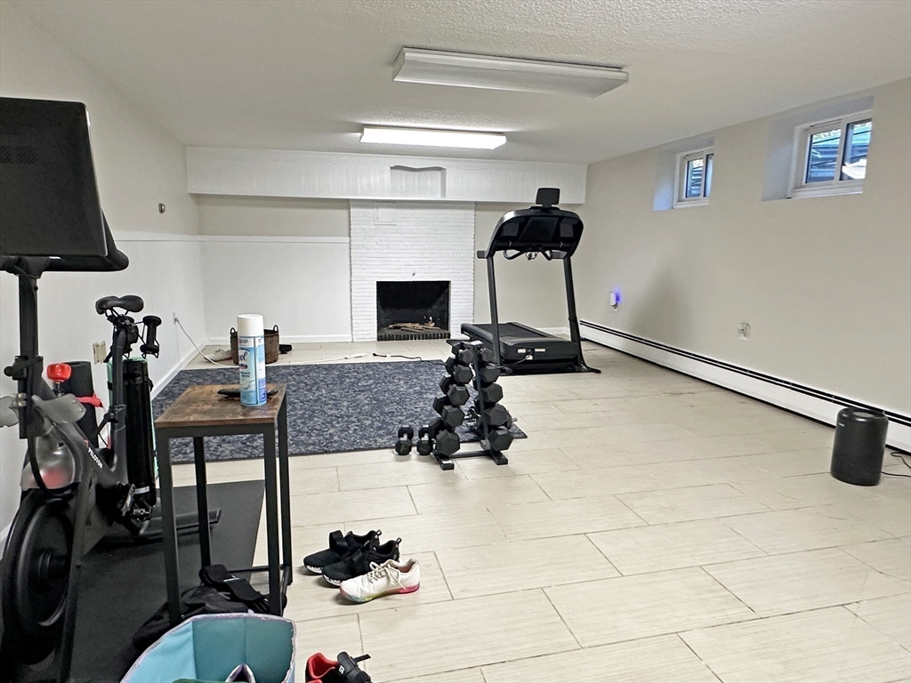 6 Brownson Terrace Boston, MA 02130 - Photo 28 of 38 a room with gym equipment and a view of living room
