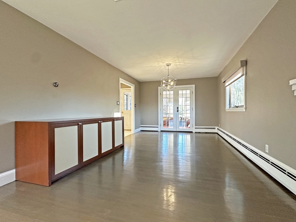6 Brownson Terrace Boston, MA 02130 - Photo 10 of 38 a view of empty room with wooden floor and fan