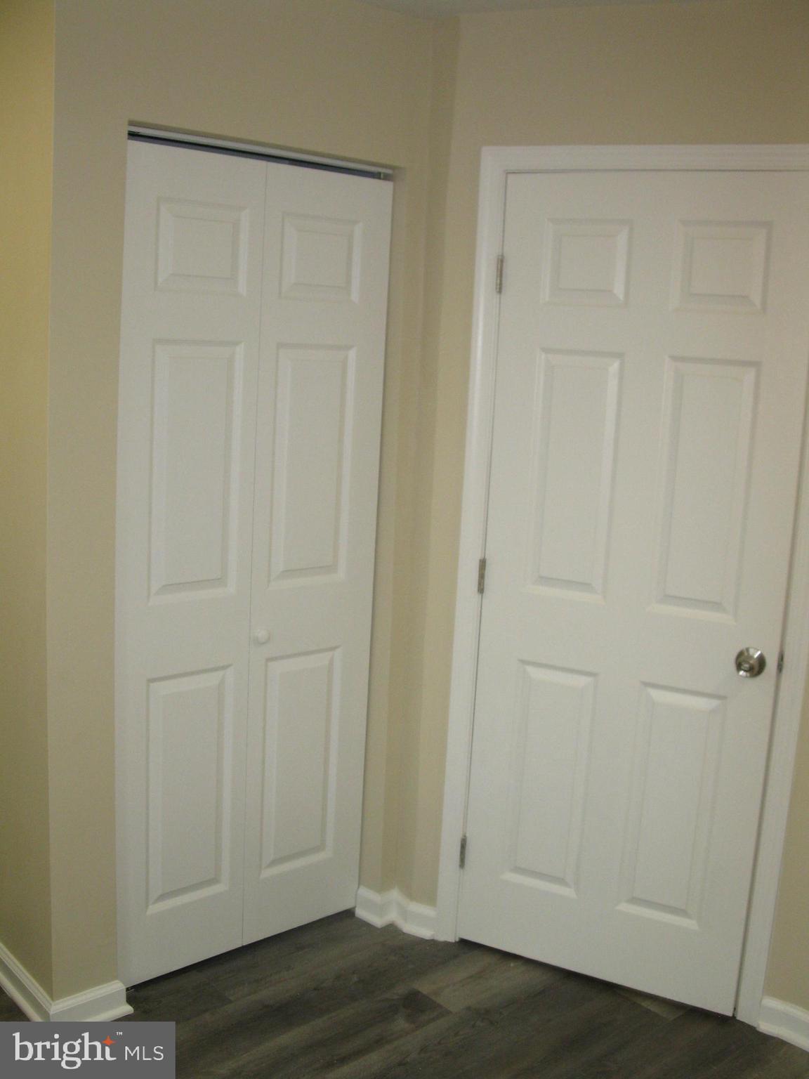 708 North Glover Street Baltimore, MD 21205 - Photo 24 of 38 an empty room with wooden floor and closet area