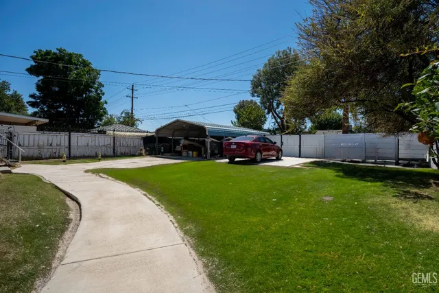 a view of house with outdoor space and swimming pool