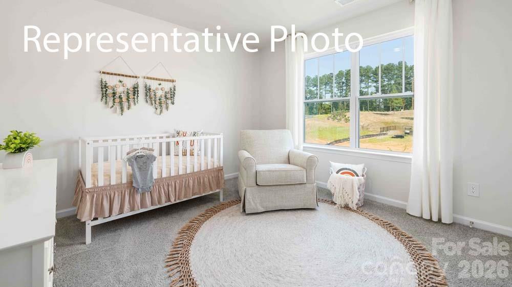 7592 Bainbridge Road Sherrills Ford, NC 28673 - Photo 22 of 28 a bedroom with furniture and a window