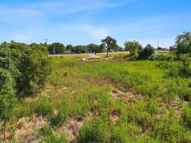 a view of a lake with houses in the back
