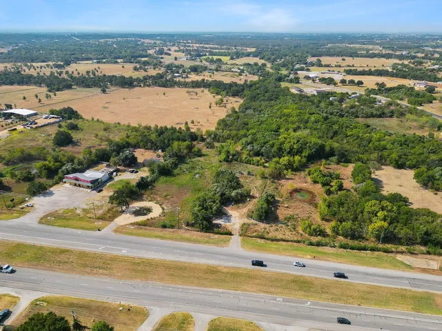 an aerial view of residential building and ocean