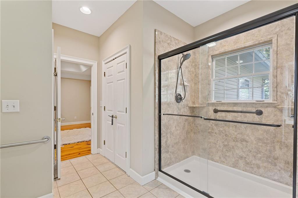 3740 Woodlane Road Gainesville, GA 30506 - Photo 22 of 74 a bathroom with a tub and a shower