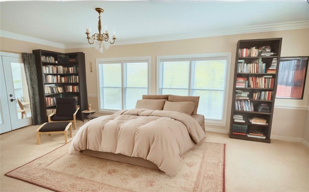 3740 Woodlane Road Gainesville, GA 30506 - Photo 26 of 70 a bedroom with a large bed and a window