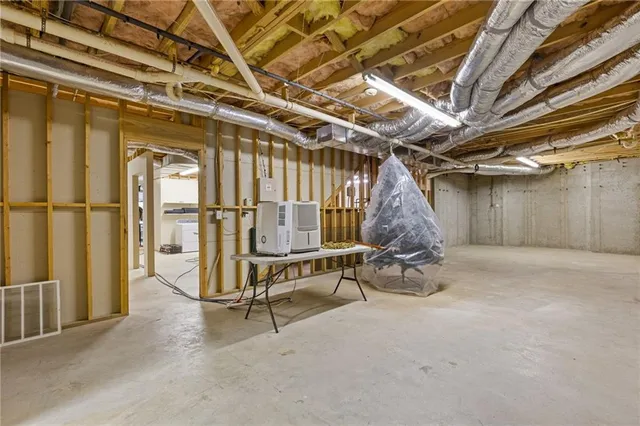 a view of a house with a yard and garage
