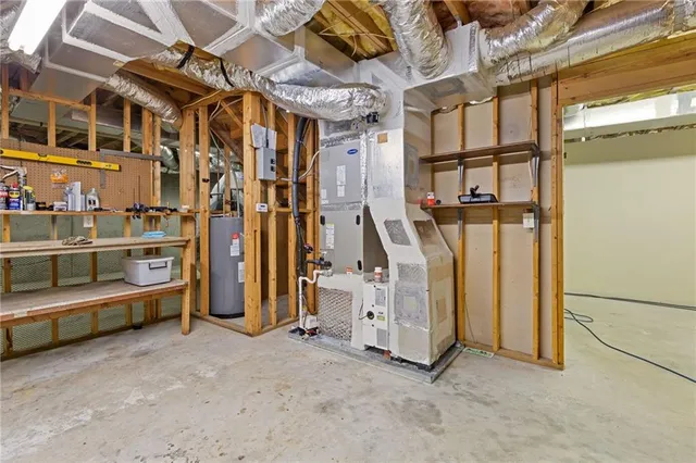 a view of a house with a yard and potted plants