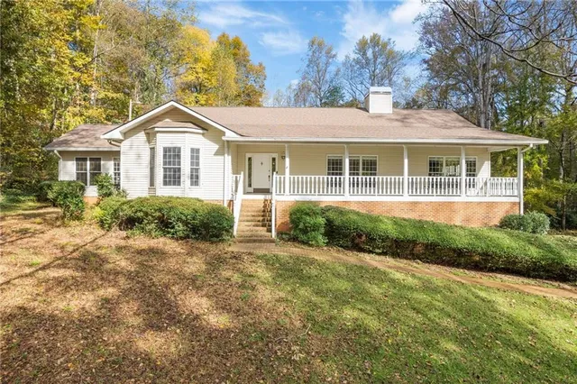 a view of a backyard with trees