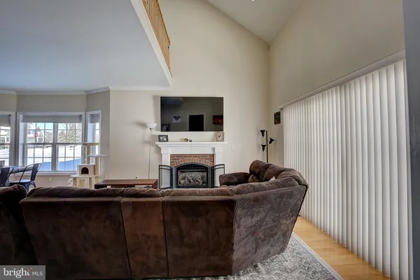 a living room with fireplace furniture and a flat screen tv