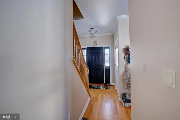 a spacious bedroom with a bed and a chandelier