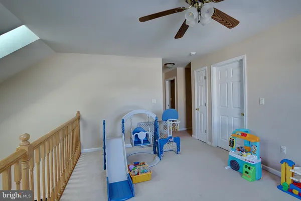 a room with gym equipment and a couch