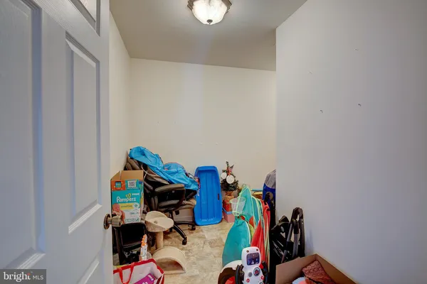 a bed room with a bed and a chandelier