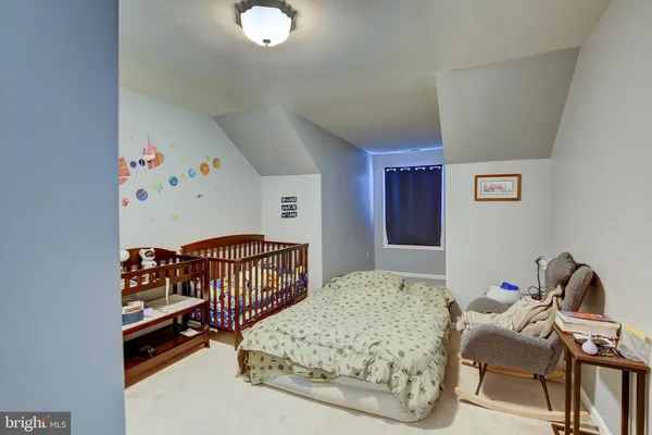 a bedroom with furniture with wooden floor