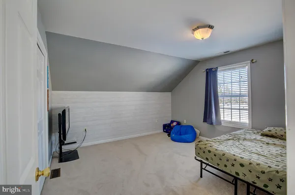 a view of an empty room and a window