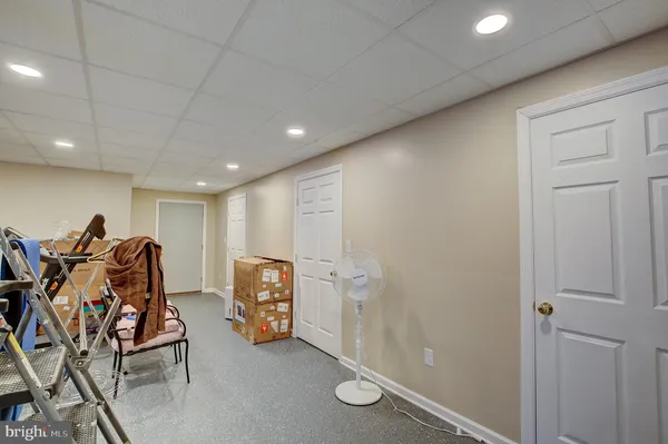 a white toilet sitting next to a bathroom sink