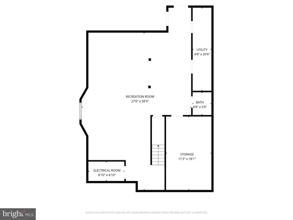 a picture of a bench in front of a wall