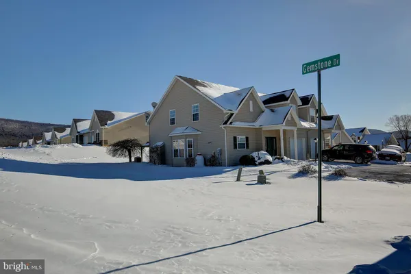 a patio with a table and chairs