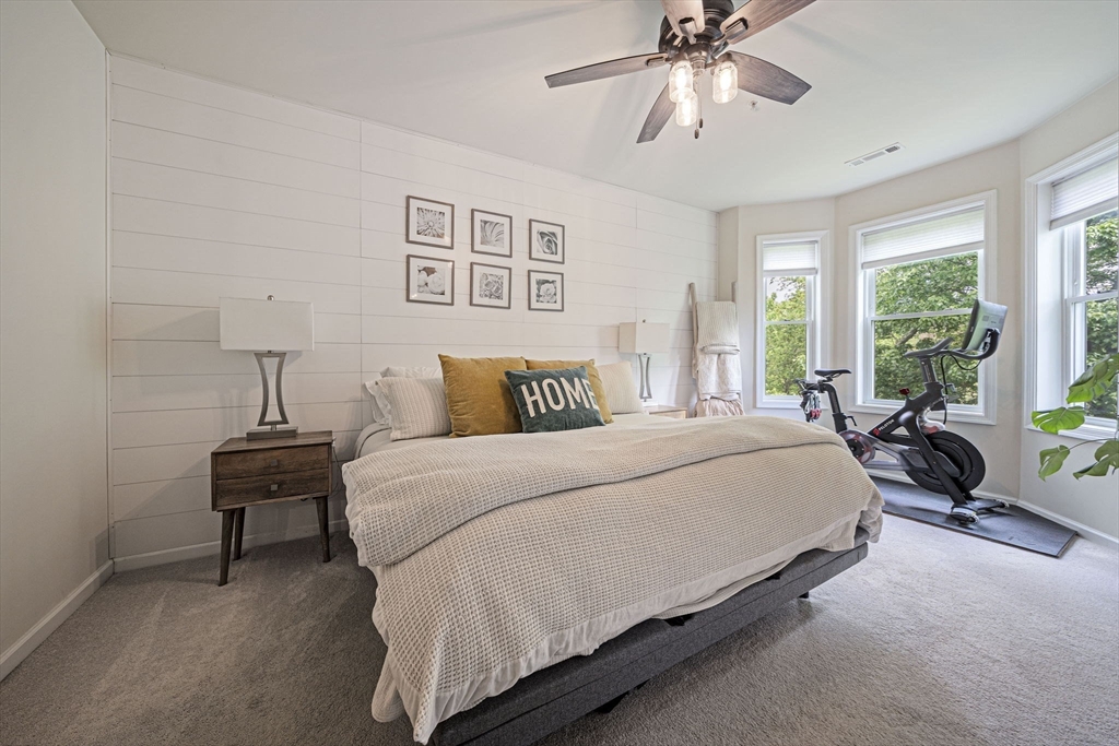 70 Trotter Road, Unit 310 Weymouth, MA 02190 - Photo 5 of 14 a bedroom with a bed and ceiling fan
