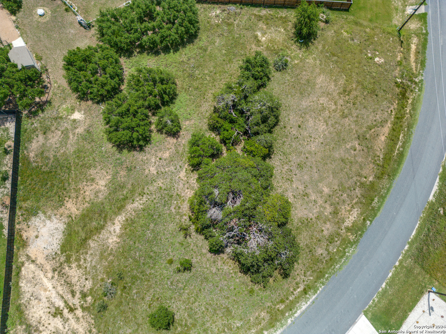 204 Hiram Cook Blanco, TX 78606 - Photo 2 of 15 a view of a forest from a balcony