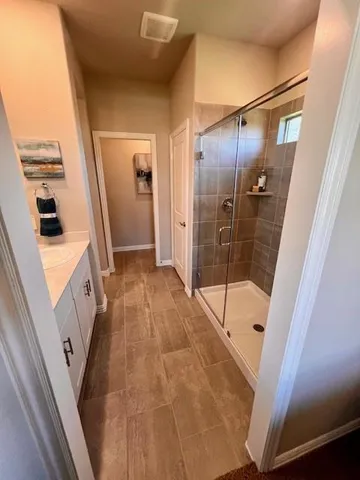 a bathroom with a tub and shower