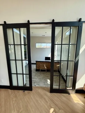 a view of a living room and hardwood floor