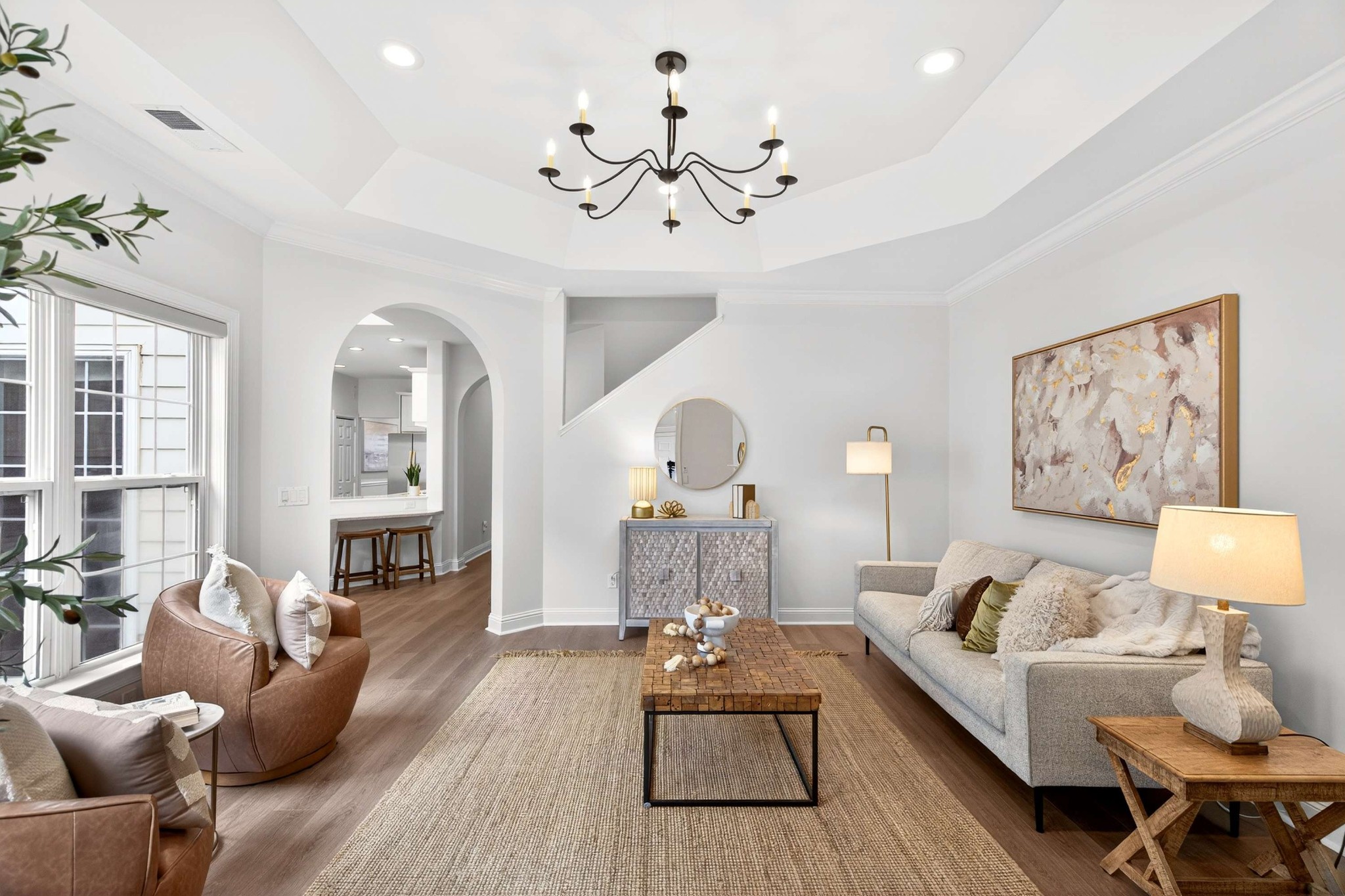 630 Springlake Drive Franklin, TN 37064 - Photo 2 of 35 a living room with furniture and a chandelier