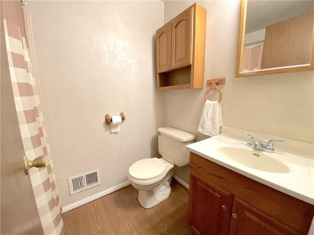 1821 Cowling Road Scottdale, PA 15683 - Photo 13 of 24 a bathroom with a sink a toilet and a mirror