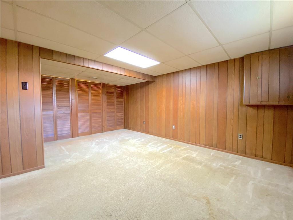 1821 Cowling Road Scottdale, PA 15683 - Photo 17 of 24 a view of an empty room with a wooden door