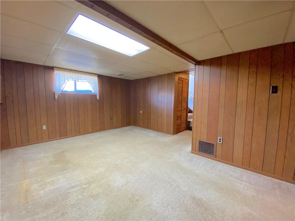 1821 Cowling Road Scottdale, PA 15683 - Photo 18 of 24 an empty room with windows and entrance