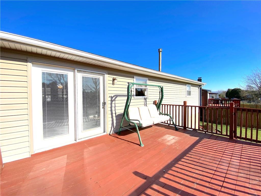 1821 Cowling Road Scottdale, PA 15683 - Photo 21 of 24 a view of a balcony with furniture and floor to ceiling window