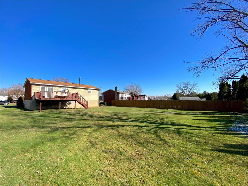 1821 Cowling Road Scottdale, PA 15683 - Photo 23 of 24 a front view of a house with a garden and trees