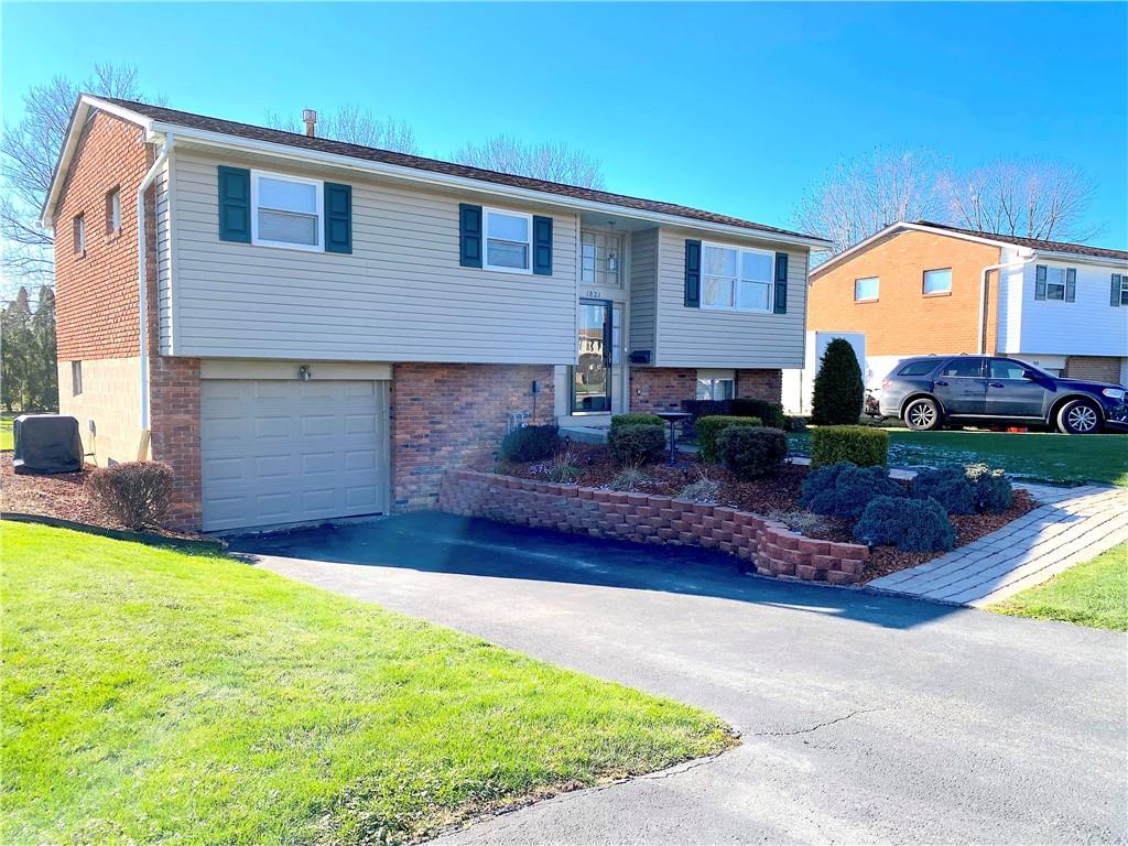 1821 Cowling Road Scottdale, PA 15683 - Photo 3 of 24 a front view of a house with garden