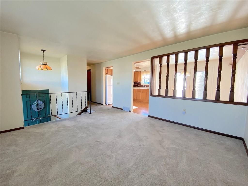 1821 Cowling Road Scottdale, PA 15683 - Photo 4 of 24 a view of an empty room with stairs