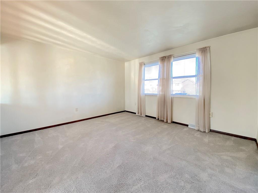 1821 Cowling Road Scottdale, PA 15683 - Photo 6 of 24 an empty room with windows