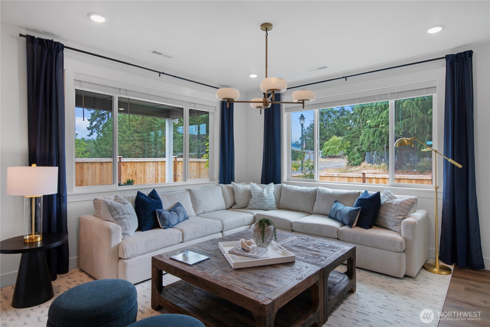 629 Gooseberry Place Sequim, WA 98382 - Photo 11 of 31 a living room with furniture and a large window