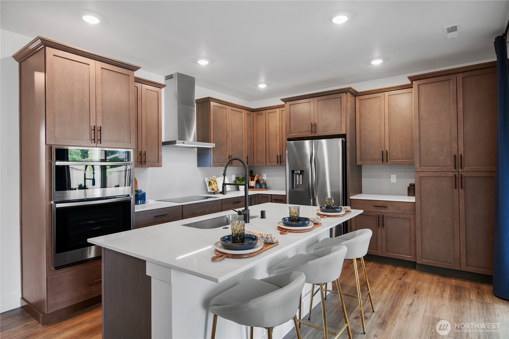 629 Gooseberry Place Sequim, WA 98382 - Photo 2 of 31 a kitchen with refrigerator cabinets and dining table