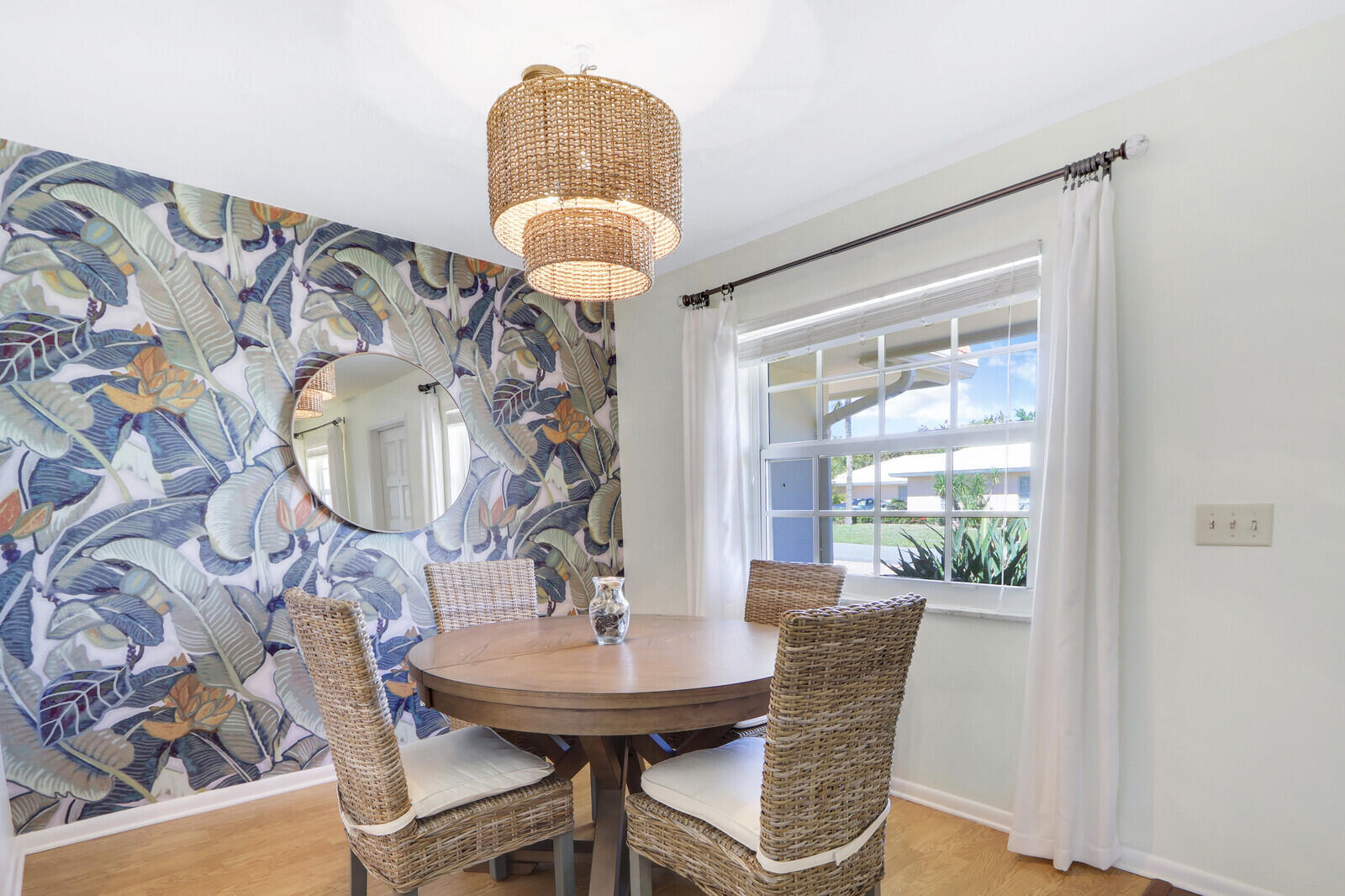 8574 Southeast Seagrape Way Hobe Sound, FL 33455 - Photo 12 of 38 a view of a dining room with furniture and wooden floor