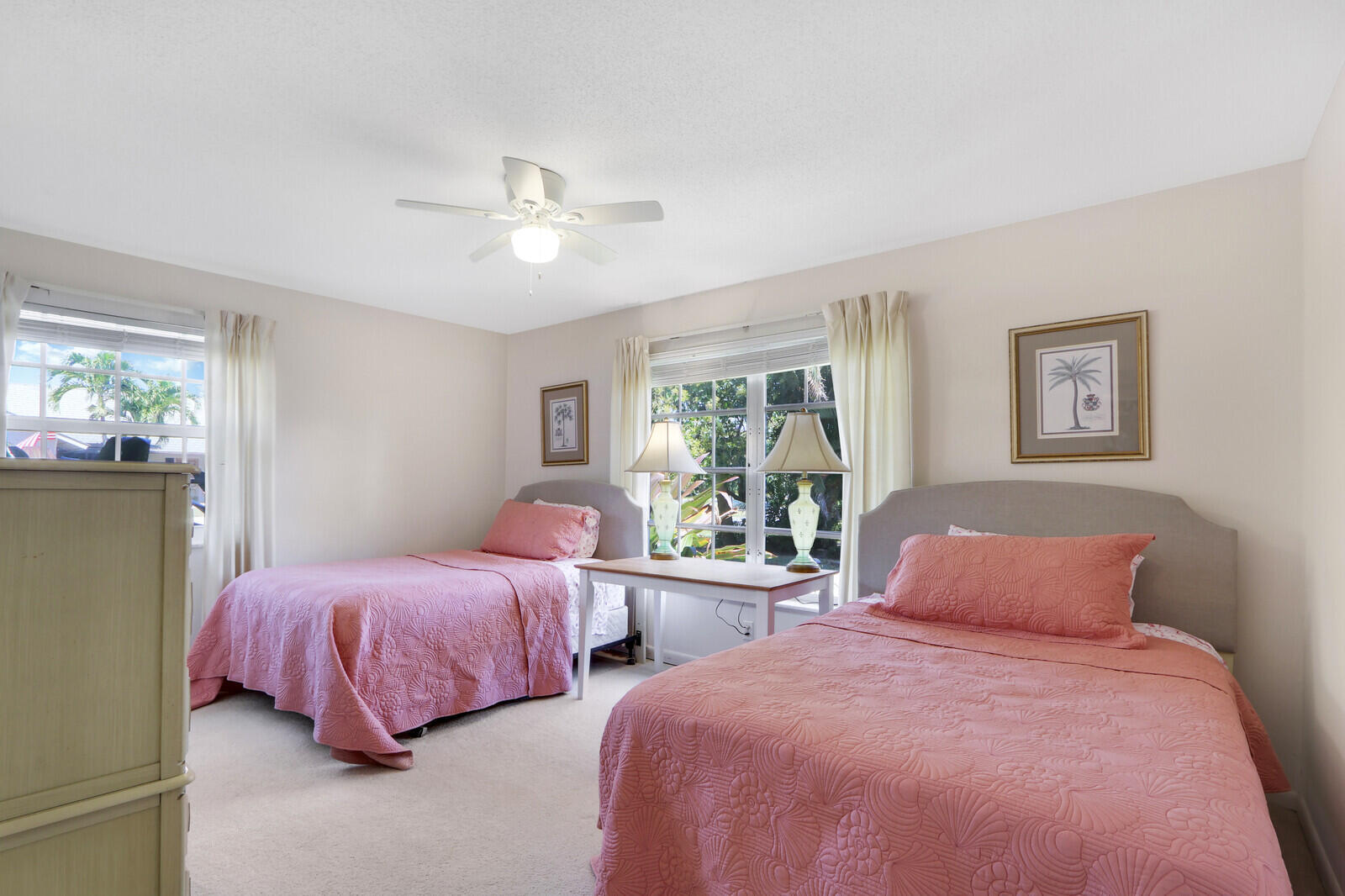 8574 Southeast Seagrape Way Hobe Sound, FL 33455 - Photo 22 of 38 a bedroom with two beds and a large window