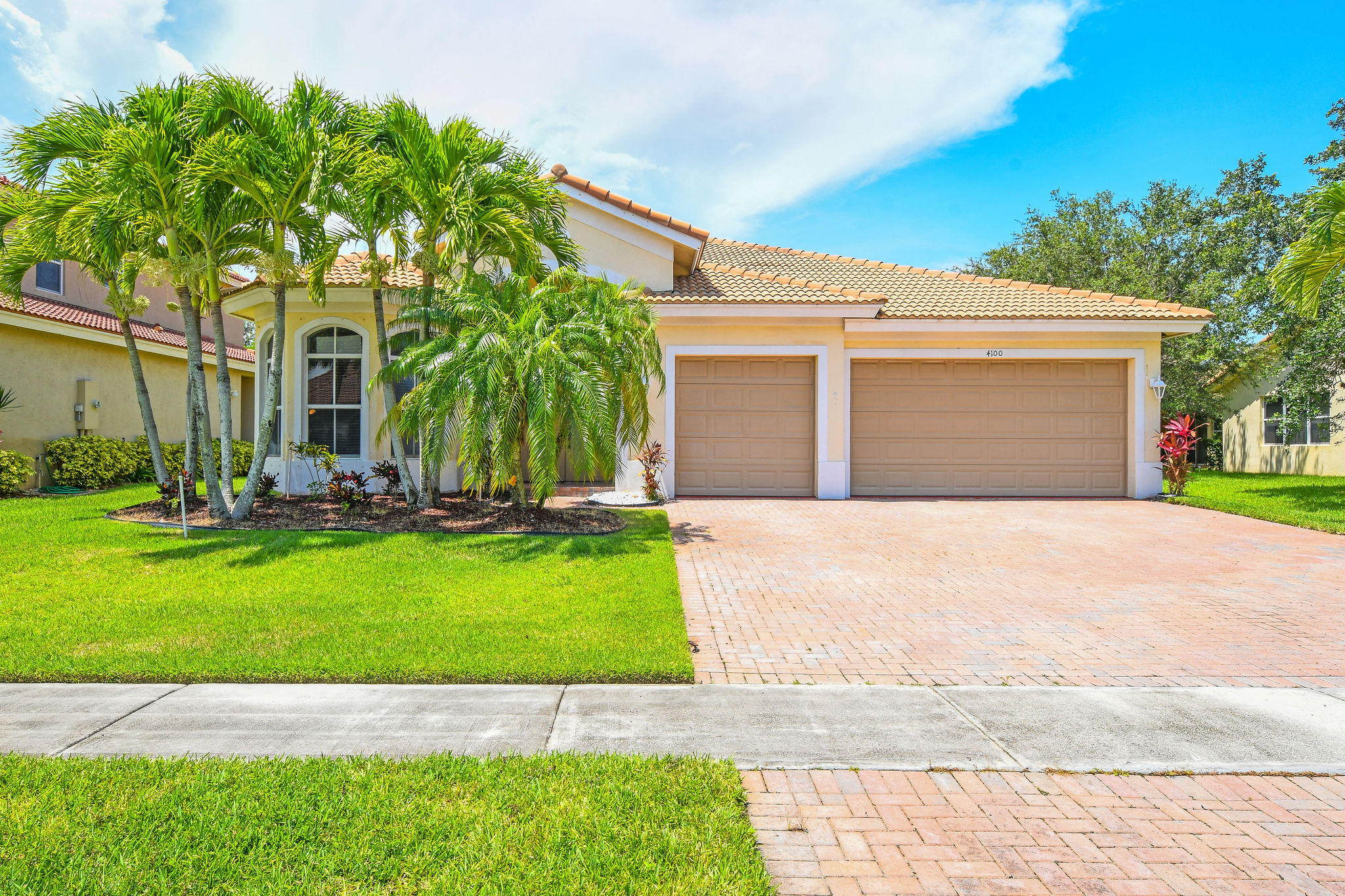 4100 Silverstone Drive Fort Pierce, FL 34947 - Photo 1 of 42 a front view of a house with a yard and garage