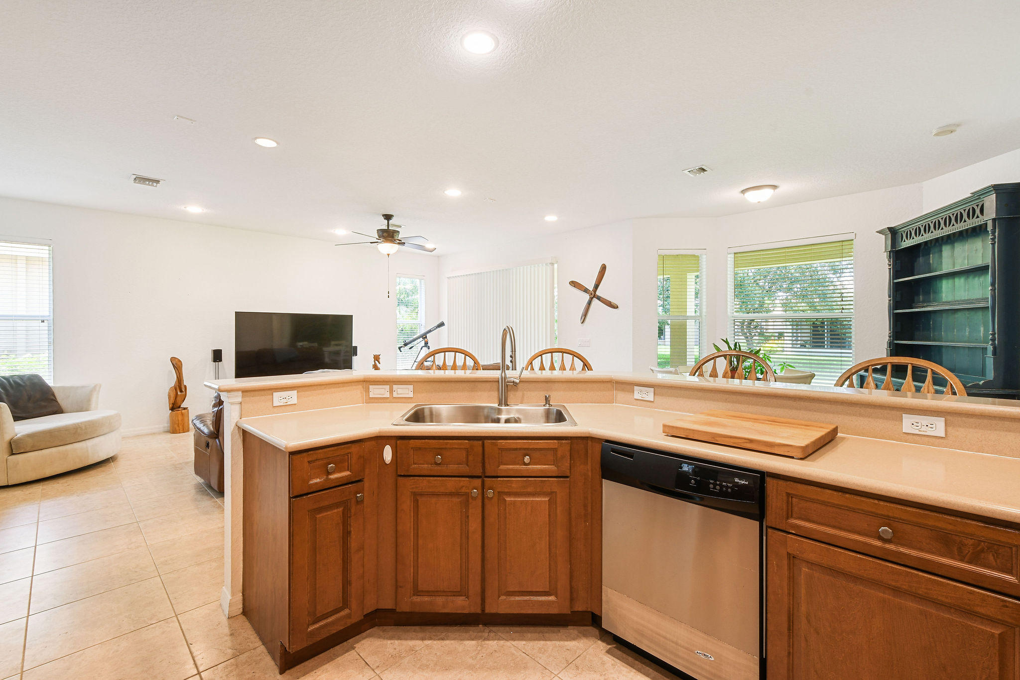 4100 Silverstone Drive Fort Pierce, FL 34947 - Photo 20 of 42 a kitchen with stainless steel appliances granite countertop a sink and a stove