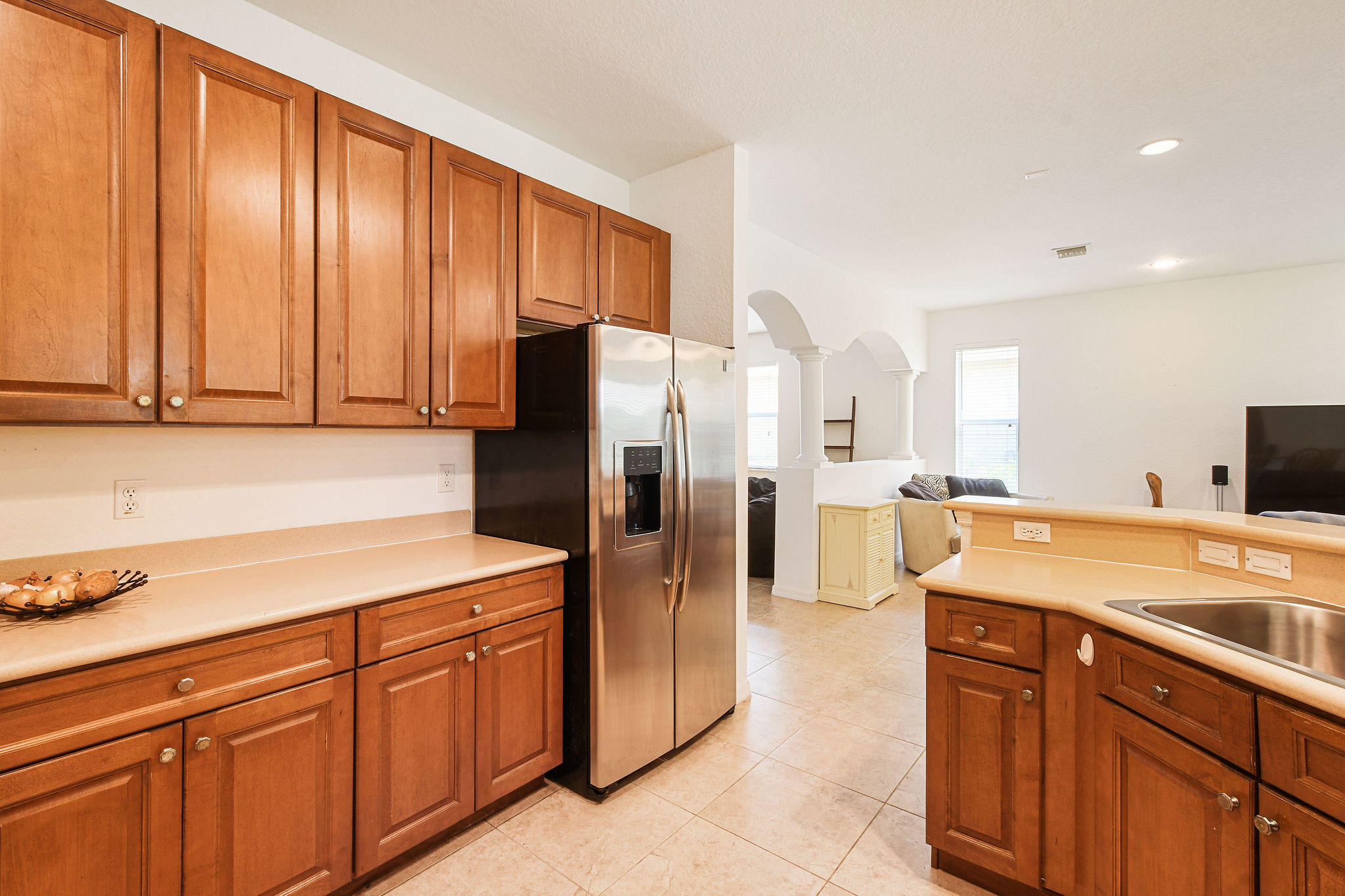 4100 Silverstone Drive Fort Pierce, FL 34947 - Photo 21 of 42 a kitchen with a refrigerator sink and cabinets