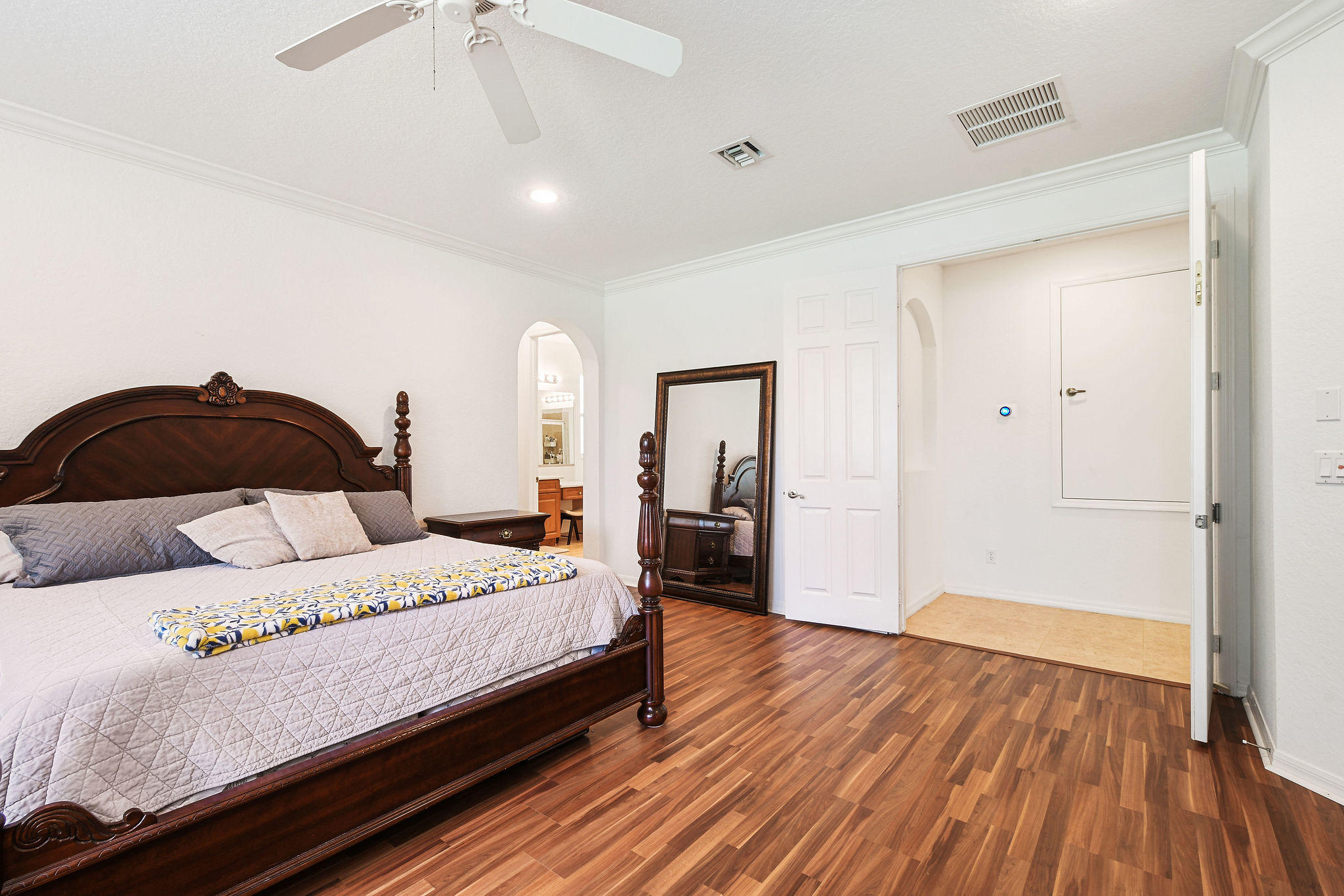 4100 Silverstone Drive Fort Pierce, FL 34947 - Photo 25 of 42 a bedroom with a bed and wooden floor