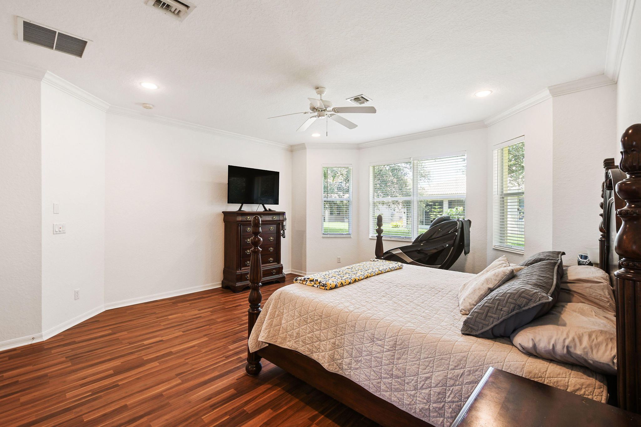 4100 Silverstone Drive Fort Pierce, FL 34947 - Photo 26 of 42 a bedroom with a bed furniture and a flat screen tv