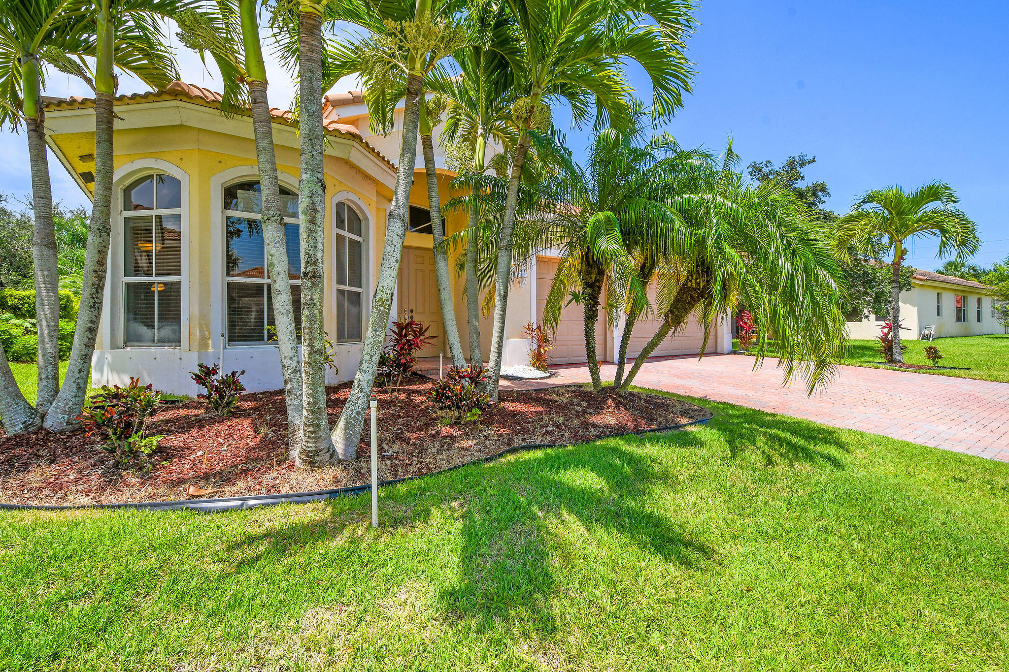 4100 Silverstone Drive Fort Pierce, FL 34947 - Photo 3 of 42 a view of a house with a yard