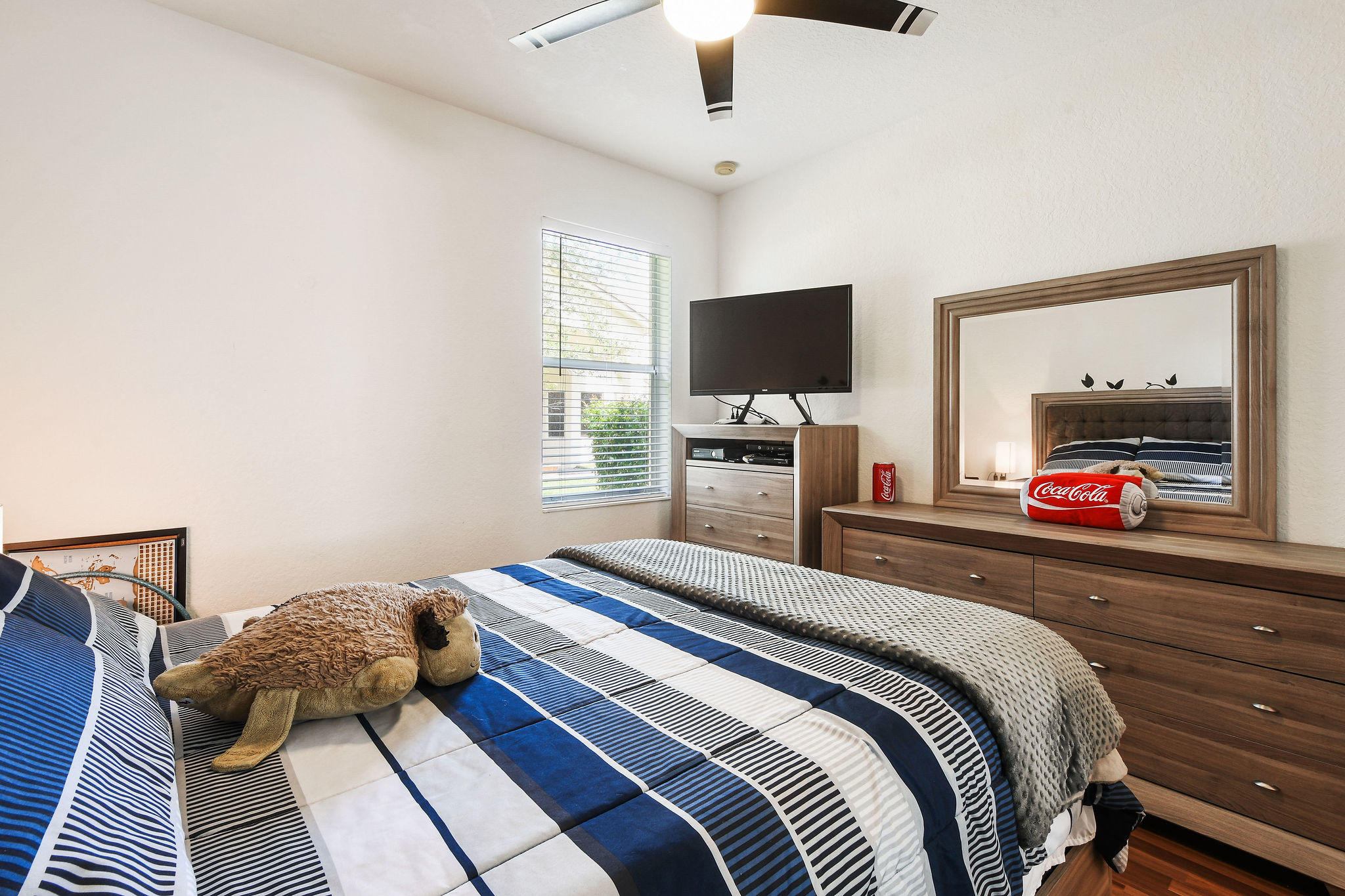 4100 Silverstone Drive Fort Pierce, FL 34947 - Photo 32 of 42 a bedroom with a bed and a flat screen tv