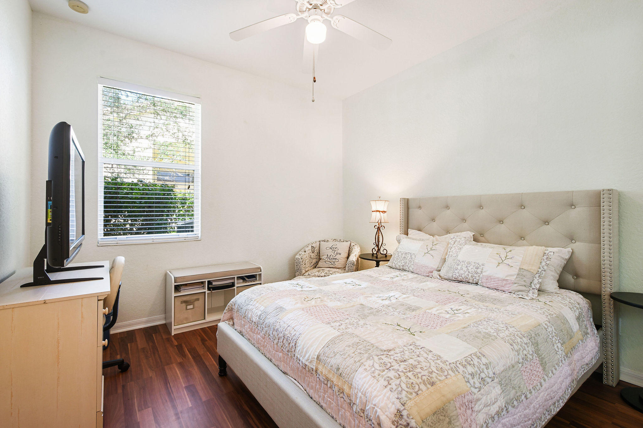 4100 Silverstone Drive Fort Pierce, FL 34947 - Photo 34 of 42 a bedroom with a bed and a chandelier